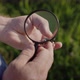Researcher Looks at Large Deer Beetle Through Magnifying Glass Top View - VideoHive Item for Sale
