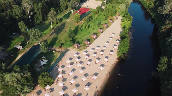 Aerial Top View of River Sand Beach with Lounges and Umbrellas