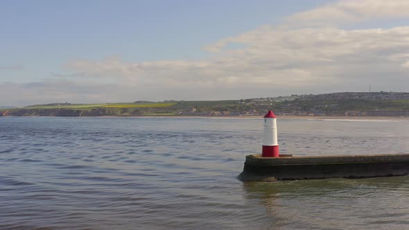 Berwick Breakwater and a Lighthouse in the Summer