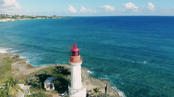 A Lighthouse Near Blue Sea on Coast, Aerial View on a Lighthouse Near the Atlantic Ocean Shore