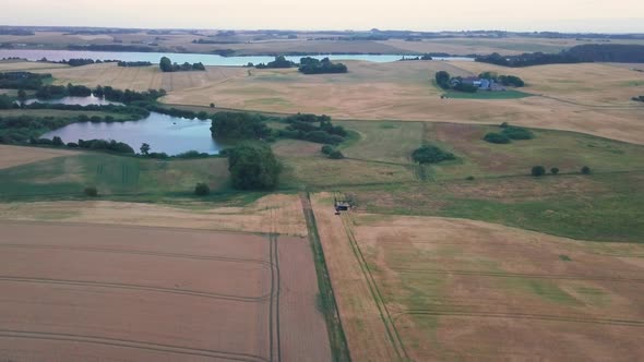 Drone By the Field on the Horizon of the Clear White Skies