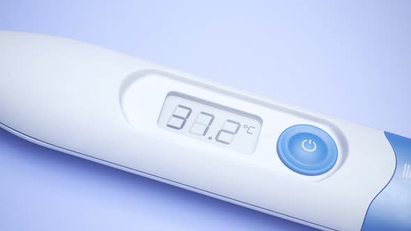 Closeup view at a thermometer with rising temperature value. Fever, flu. 4KHD