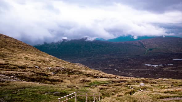 Cinematic timelapse of misty clouds on top of scottish highlands during golden hour