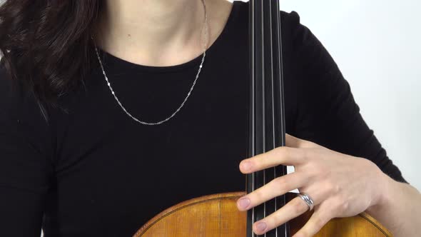 Girl Is a Musician Sit and Playing the Cello