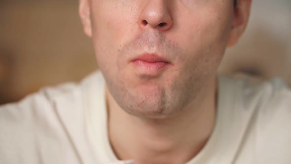 Close-up of a Man Eating Food.