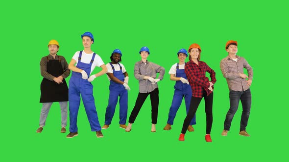 Happy Team Of Construction Workers Dancing Disco on a Green Screen Chroma Key