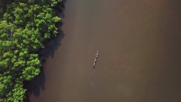 Drone view of a traditional boat on a river in Africa