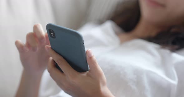 Asian Woman Use of Smart Phone at Home