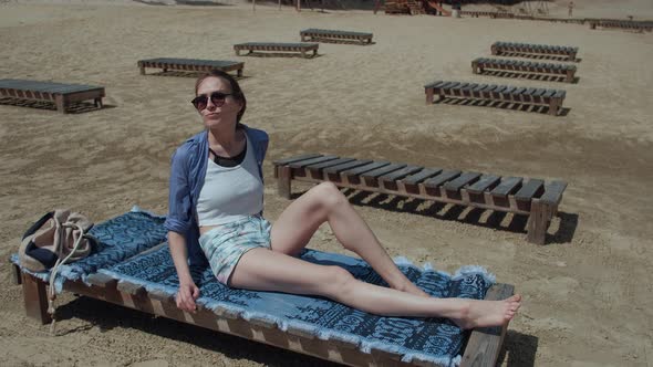 Attractive Girl Resting on the Beach