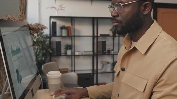 Black Man Typing on Computer