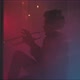 A musician playing the trumpet in a room with smoke and neon lights - VideoHive Item for Sale