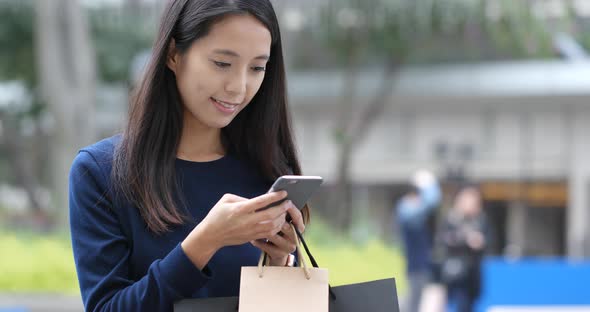 Woman use of cellphone at outdoor