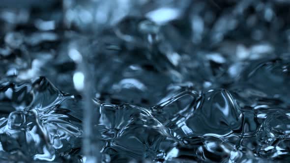 Super Slow Motion Abstract Shot of Waving Blue Clear Liquid Background at 1000Fps