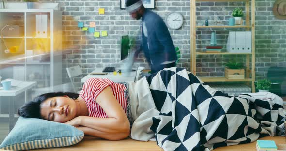 Time Lapse Portrait of Employee Napping on Office Desk Under Blanket in Workplace