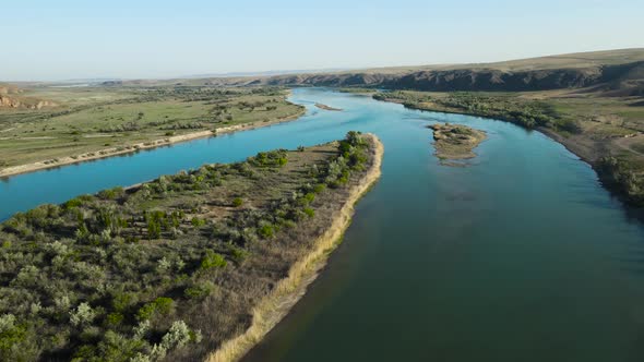 Drone Shot of River and Mountains at Sunset in Kazakhstan