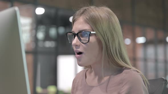 Portrait Shoot of Successful Woman Working on Desktop