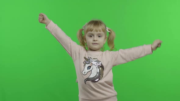 Girl in Unicorn Sweatshirt Dancing. Happy Four Years Old Child. Chroma Key