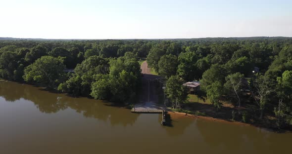 Alabama River in Boykin, Alabama showing ferry dock with drone video moving down.