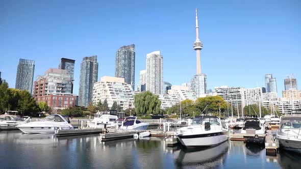 Toronto skyline view with pier and boats on foreground