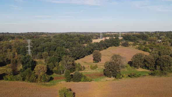 Pedestal Shot Reveal Of Power Lines In A Small Rural Town