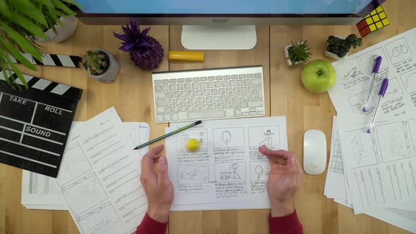 Man At Workplace With Computer And Storyboard Flat Lay