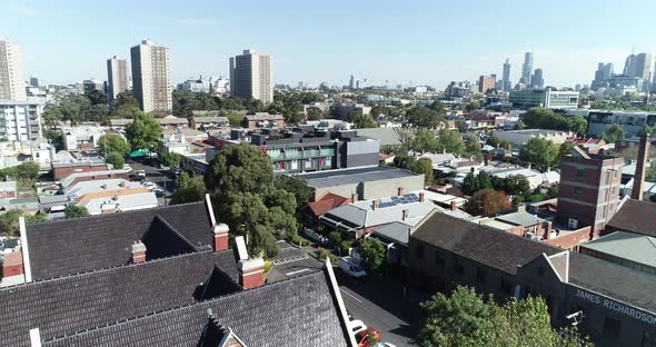 Drone ascend and reveal of Melbourne showing old original areas, and commotion flats through to city