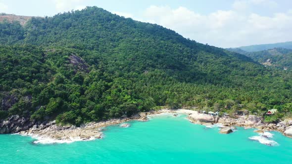 Aerial top view landscape of tropical coastline beach adventure by transparent lagoon and white sand