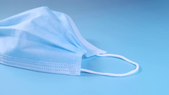 Close Up of Blue Surgical Masks on Table 