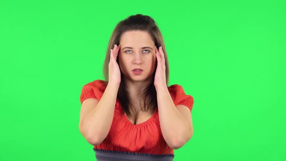 Portrait of Cute Girl Suffering From Headache From Fatigue . Green Screen
