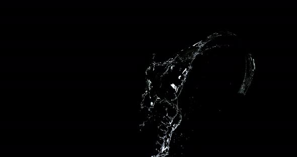 Water spurting out against Black Background, Slow motion 4K