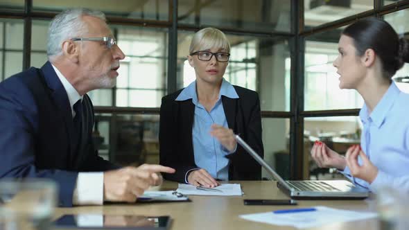 Office Employee Suffering Headache Listening to Shouting Coworkers, Stress