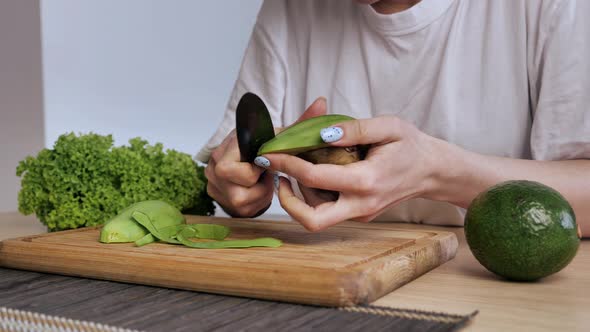 Closeup of the Cleansing of the Avocado From the Peel