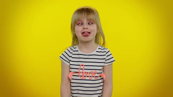 Playful Child Kid Girl Making Funny Silly Facial Expressions and Grimacing Fooling  Showing Tongue