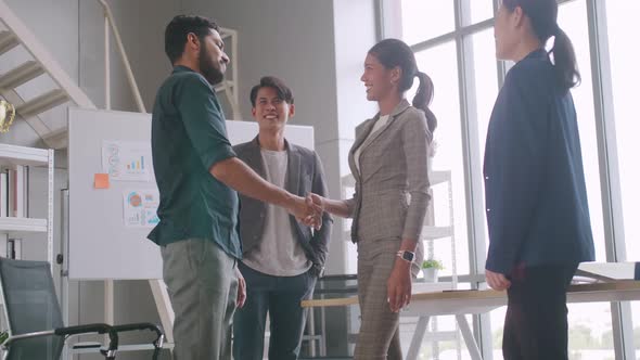 Business people shaking hands, finishing up a meeting.