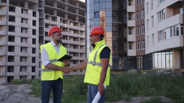 One Builder Goes to Other and Shake Their Hands