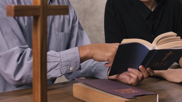 Young missionary is advising young woman in the church.