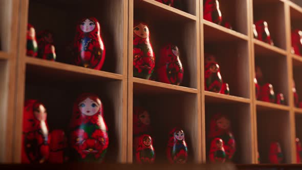 Matryoshka dolls on shelves at the desk. A huge number of talking Babushkas.