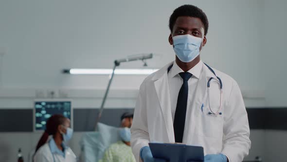 Portrait of Man Working As Doctor with Stethoscope and Files