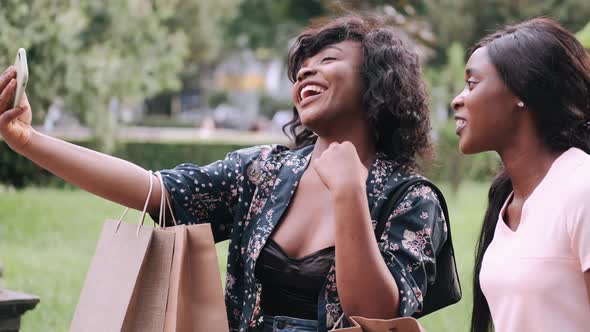 Portrait of Beautiful Young Black Women with Shopping Bags