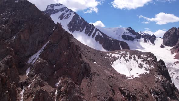 High Rocky Mountains Covered with Ice in Places