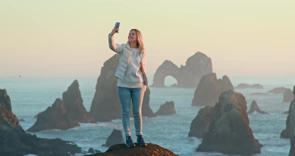 Cinematic Footage of Smiling Woman Making Selfie or Video Call on Mobile Phone