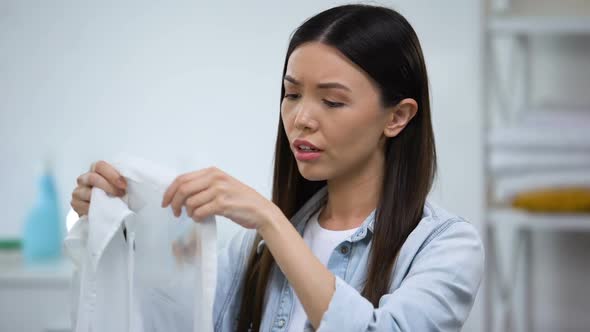 Sad Housewife Holding Shirt With Coffee Stain, Laundry Problems, Spot Remover