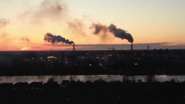  Smoking Stack in Sunrise. Air Pollution and Climate Change Theme. Poor Environment in the City