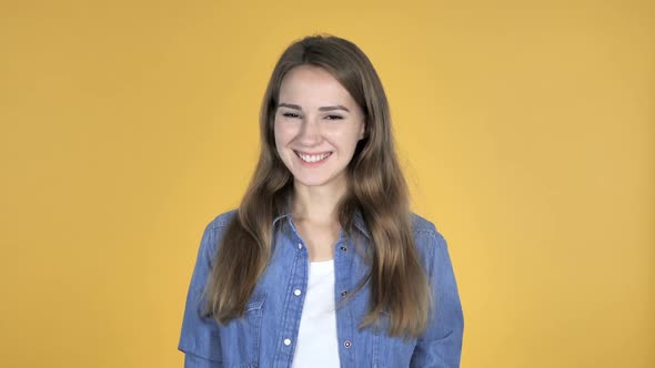 Yes Pretty Woman Shaking Head to Accept Isolated on Yellow Background