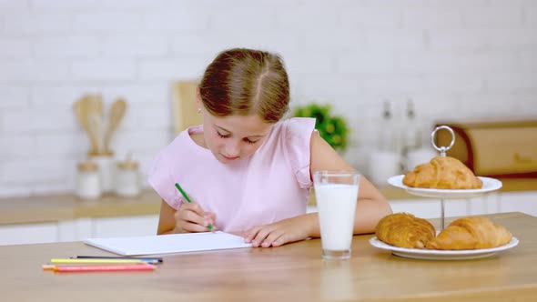 Girl Draws in the Kitchen