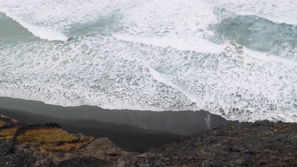 Powerful Waves Rolling Into Rocky Volcanic Coastline. Abandoned Black Sand Beach on Trekking Trail