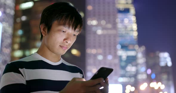 Man use of smart phone at night