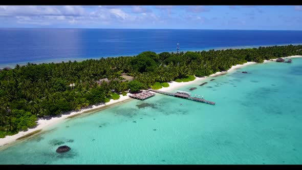 Aerial scenery of perfect seashore beach vacation by blue green sea with white sand background of a 