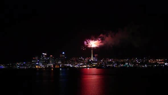 Firework from Sky Tower in Auckland ending with a big explosion of fireworks