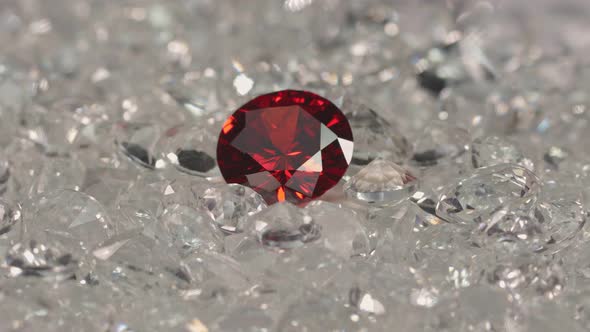 Red Ruby Diamond On A Pile Of White Diamonds.